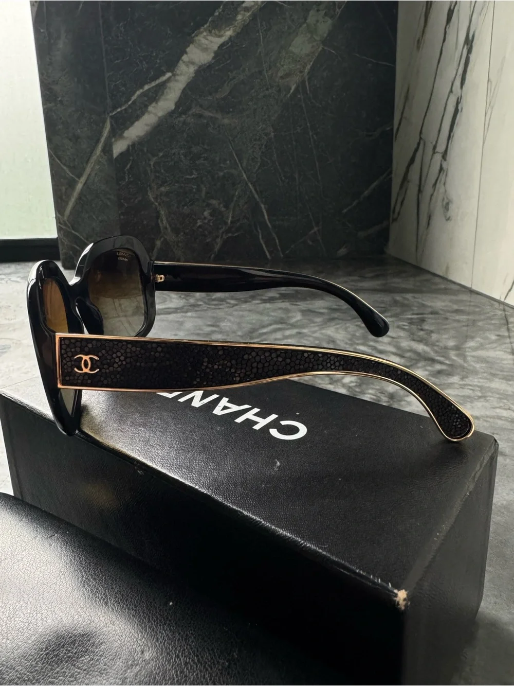 CHANEL Black Sunglasses with Gold Logo Accent